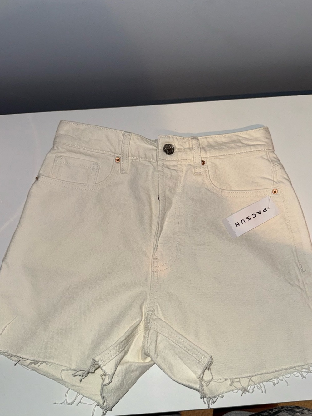 Cream High-Rise Distressed Hem Denim Shorts